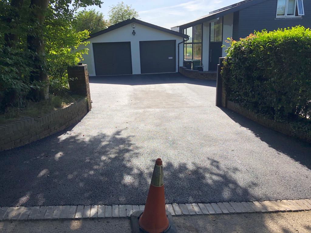 This is a photo of a bitumen driveway which is in the process of being installed by Richmond Road Tech