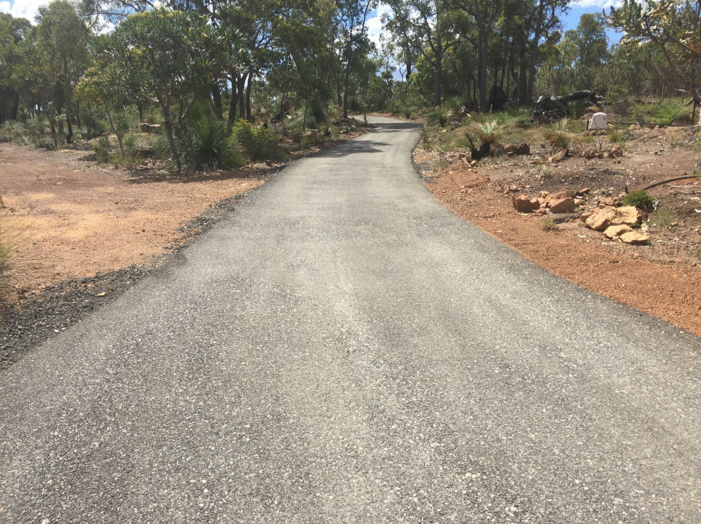 This is a photo of a hot spray & seal bitumen driveway which is in the process of being installed by Richmond Surfacing Solutions