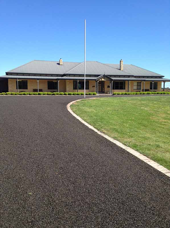 This is a photo of an asphalt driveway which has been installed by Richmond Surfacing Solutions